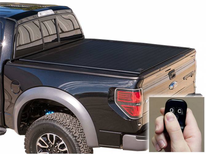 Retrax Powertrax bed cover on a black raptor with the remote shown in the bottom right corner 