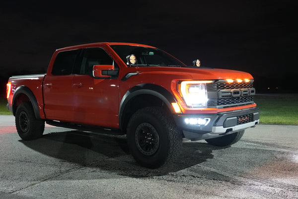Red Ford Truck at night with Grill Lights and Headlights