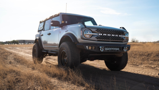 ford bronco on a dirt road
