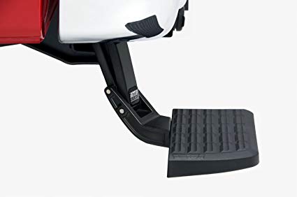 AMP Rear Bed Step shown on the rear bumper extended 