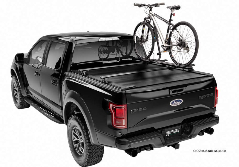 Powertrax Pro XR with the rack accessory supporting a bike on a black Raptor