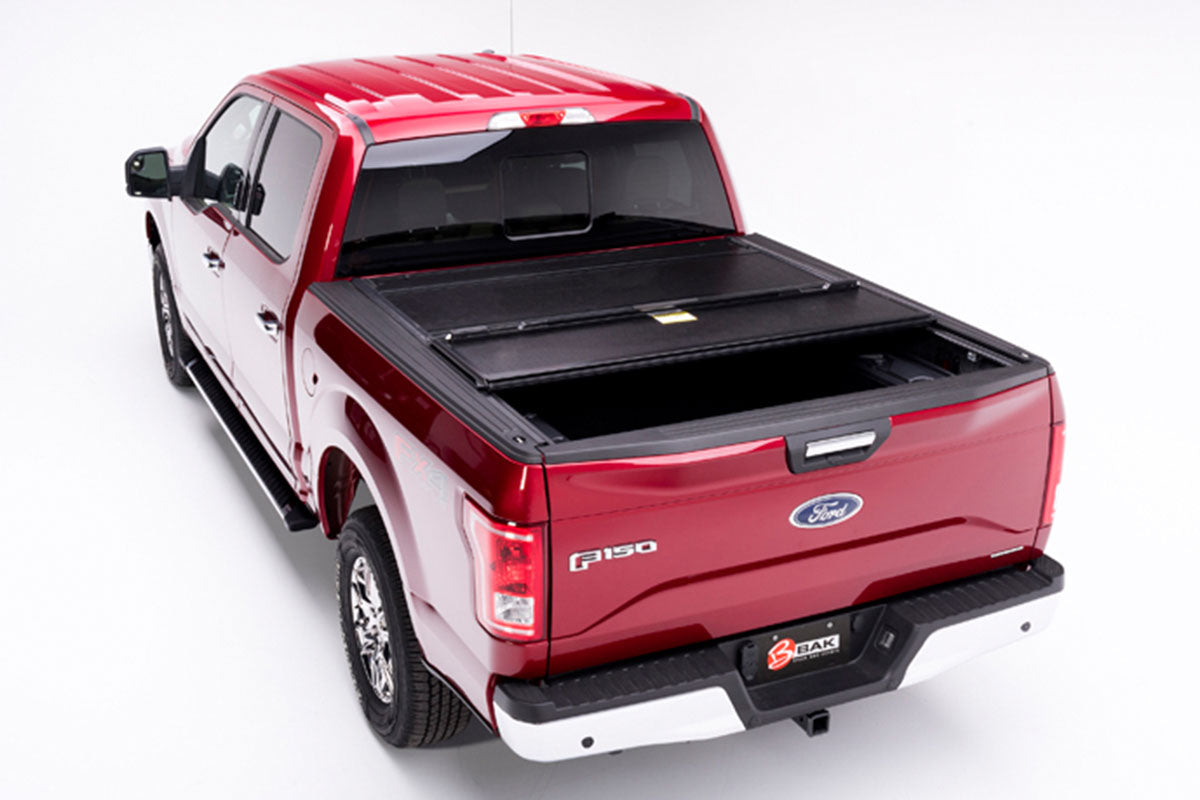 BAKFLIP F1 2015-2019 F-150 on a RED F-150 with one panel folded up
