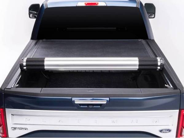BAK Revolver X2 Bed Cover for 2015-2019 F-150's shown in a blue Platinum F-150 half rolled 