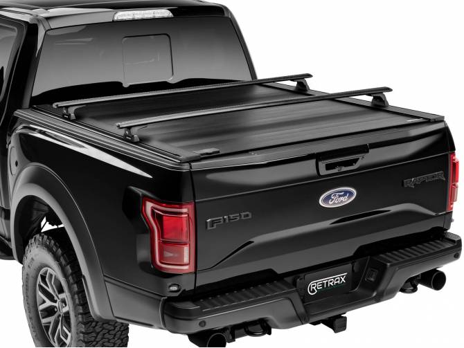 Powertrax Pro XR Bed cover shown closed with rack accessory added on a black Raptor